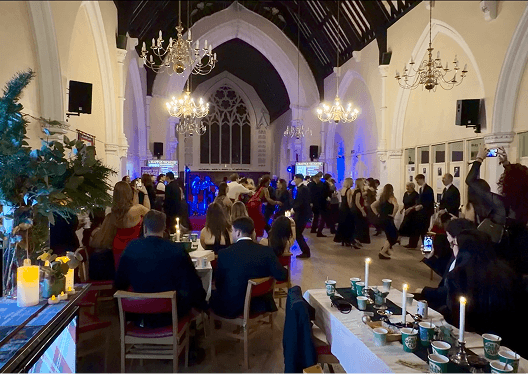 Guests filling the grand event hall at the St Andrews charity ball in London