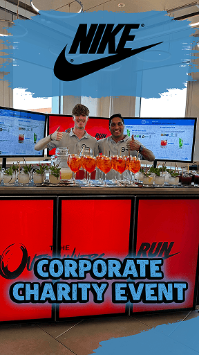 Better World Bar Hire staff serving fresh cocktails from a custom digital screen mobile bar at a Nike corporate charity event, featuring branded digital menus.