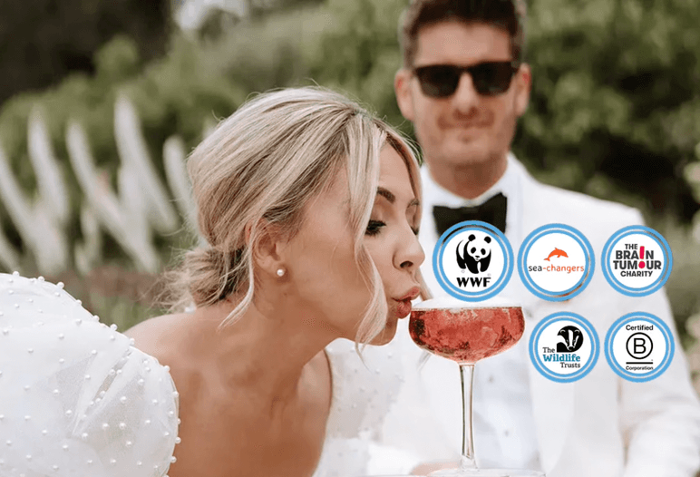 A bride sipping a pink cocktail from a champagne tower with her groom behind her, alongside the WWF, Sea-Changers, Brain Tumour Charity, Wildlife Trusts and Certified B Corporation logos, representing how every drink served at your sustainable wedding supports a vital cause